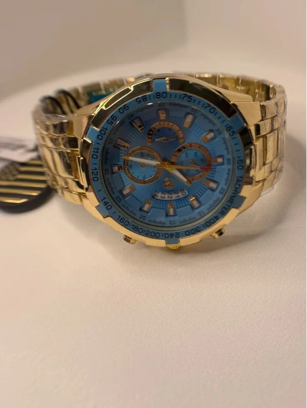 AJ heavy stainless steel, gold tone, blue face Sports Master